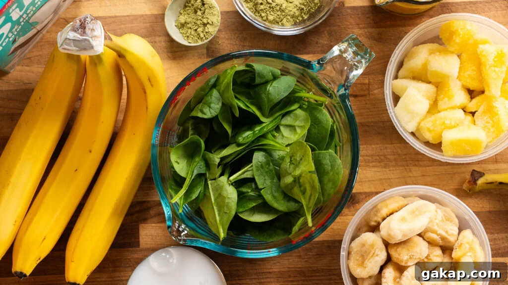 Tropical Green Island Smoothie — Ready in 5 Minutes 3 Island green tropical smoothie ingredients on a cutting board.