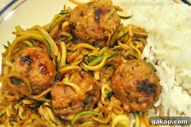 The zucchini noodles, sauce and Thai turkey meatballs are served, along with rice on the side.