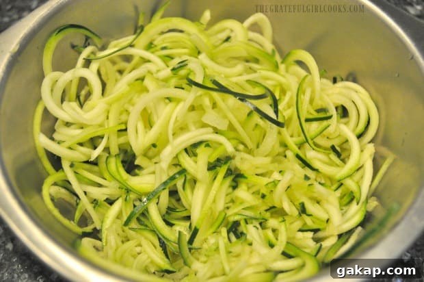 Spiralized zucchini noodles are ready to add to the Thai turkey meatballs and sauce.