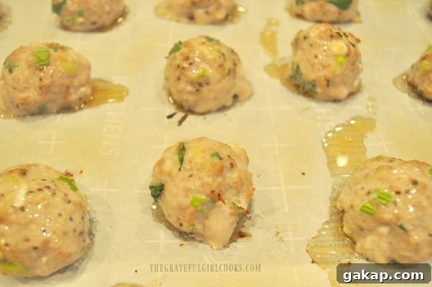 When the Thai turkey meatballs are halfway through baking, they are flipped to other side.
