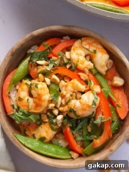 Small wooden bowl with Thai prawn curry