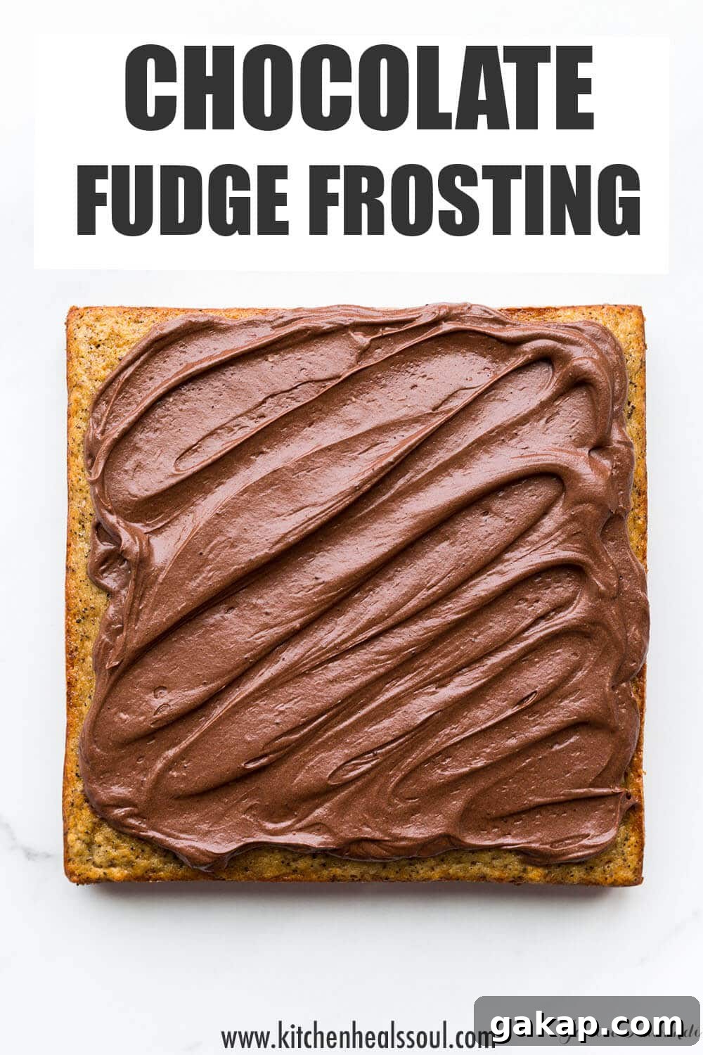 Chocolate fudge frosting on a square banana cake.