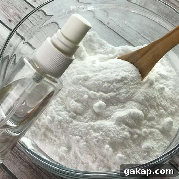 Tea Tree Acne Facial Tabs — Lush-Inspired Formula for Clear Skin 6 adding witch hazel from clear spray bottle to essential oil facial steamer tab mix of ingredients baking soda citric acid tea tree essential oil