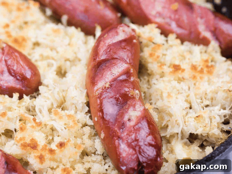 13 Classic Vintage Recipes for Cozy Fall Cooking 8 Grilled sausages served on a bed of baked sauerkraut with crispy breadcrumbs.