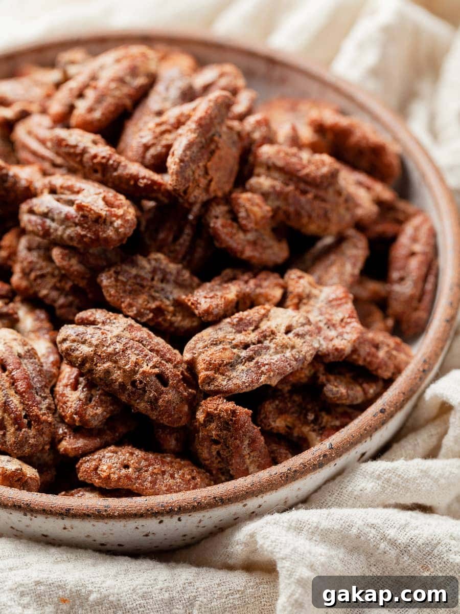a bowl of gluten free cinnamon spiced pecans