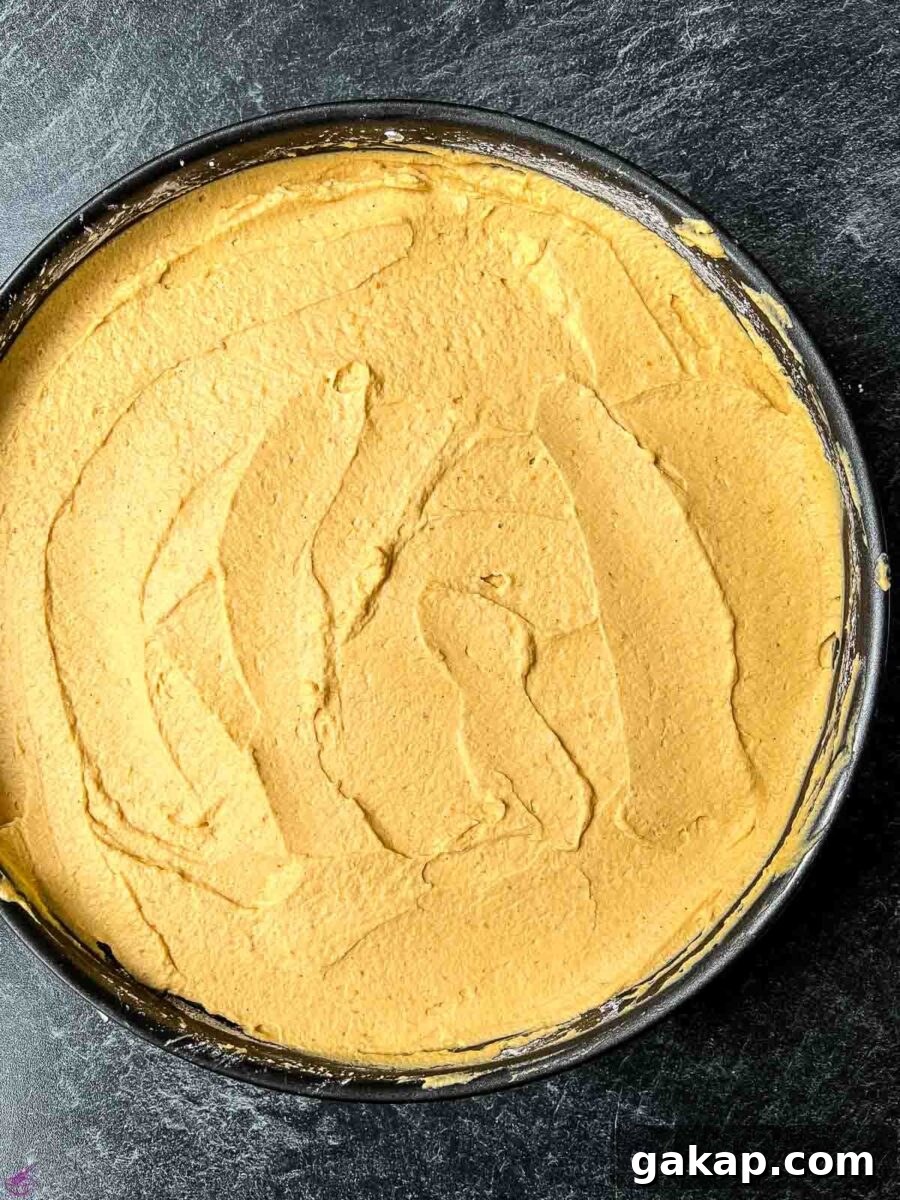 Spread the cheesecake filling on top of the cracker crumb crust.