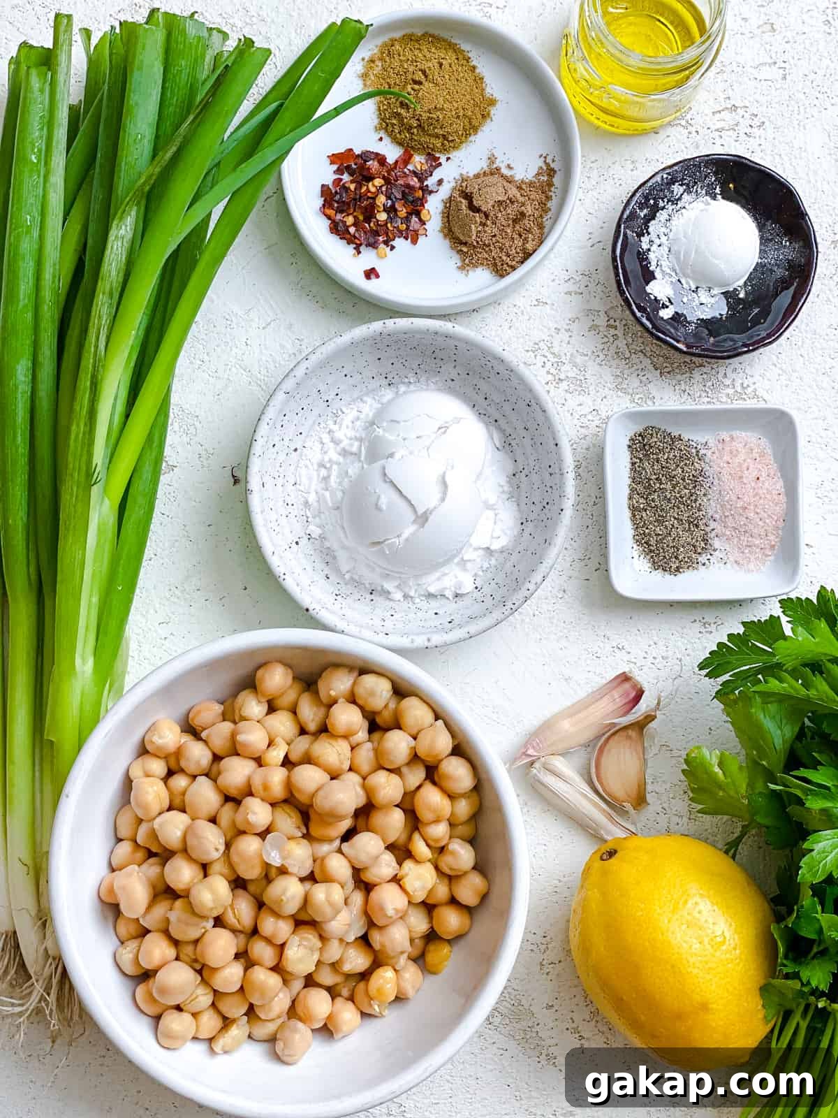 ingredients for Healthy Baked Falafel measured out against a white background