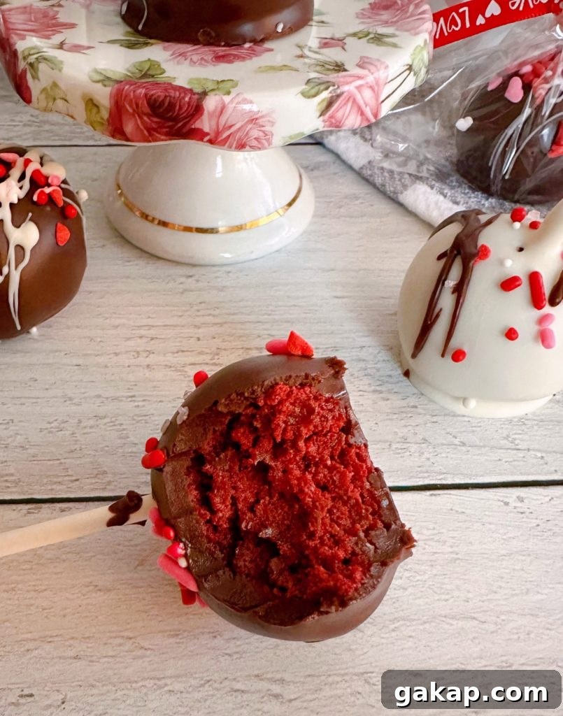 Red Velvet Cake Pops: Simple Party Dessert Recipe 10 Bite out of the red velvet cake pop.