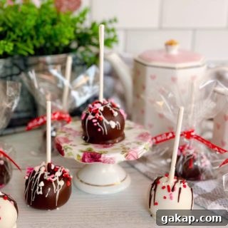 Red Velvet Cake Pops: Simple Party Dessert Recipe 12 Cake pops on a stick and wrapped for valentines day.