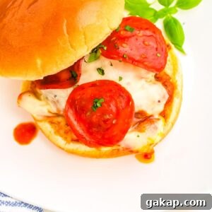 The finished pizza burgers on a white plate.