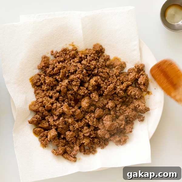 Copycat McDonald's Big Mac Wrap with Signature Sauce Recipe 6 Letting the cooked ground beef drain on a paper-towel-lined plate.