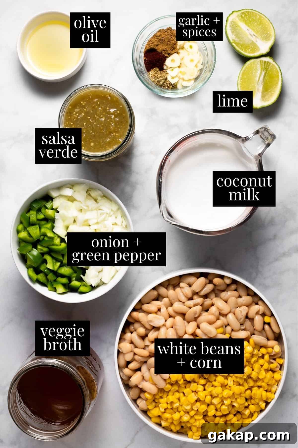 White marble counter top with ingredients to make white bean chili