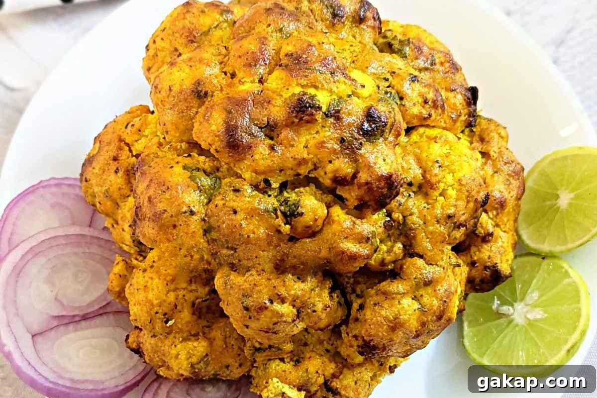 Holiday Air Fryer Recipes to Simplify Your Cooking 13 Whole cauliflower served on a white plate