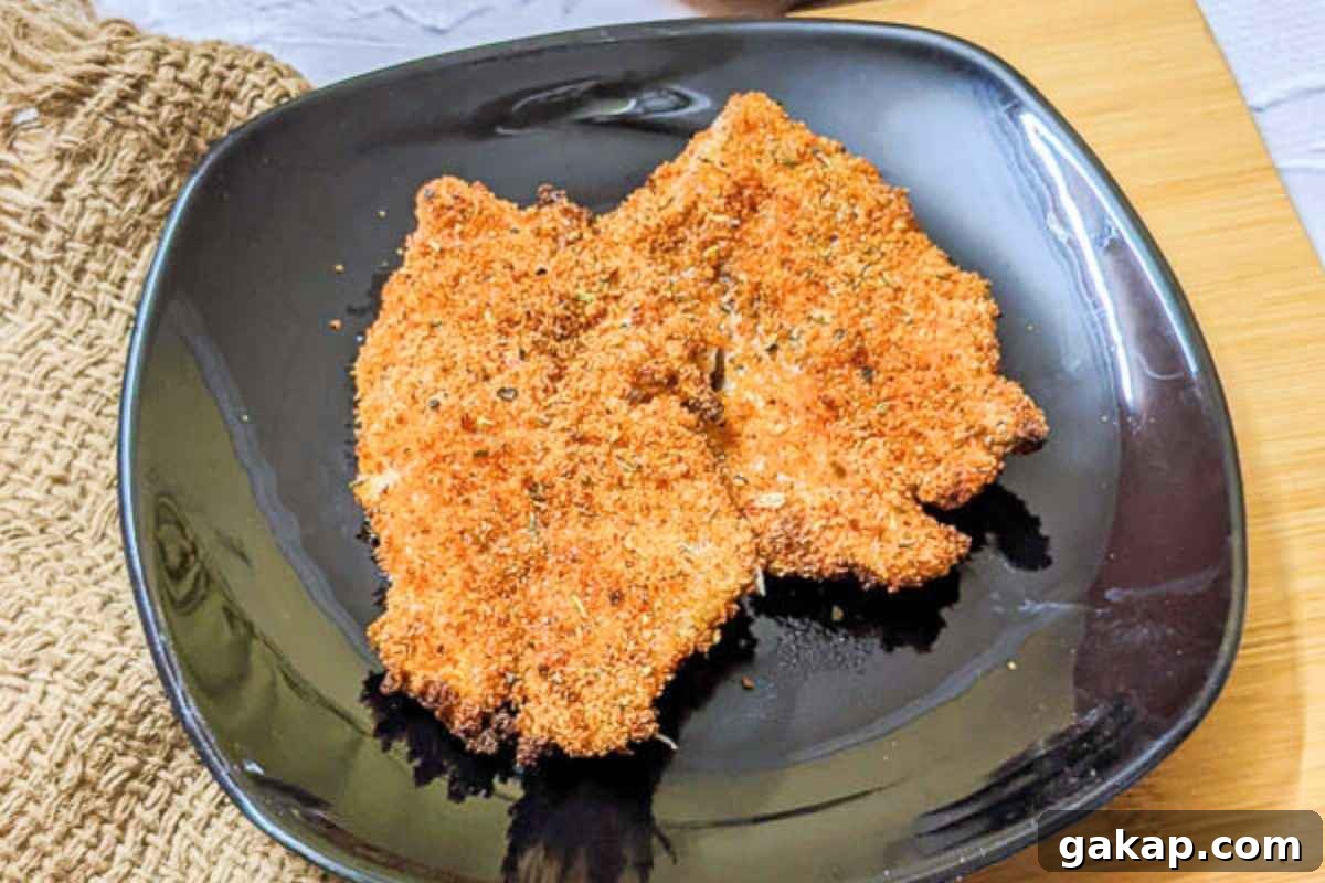 Holiday Air Fryer Recipes to Simplify Your Cooking 14 Breaded tilapia fillet on a plate