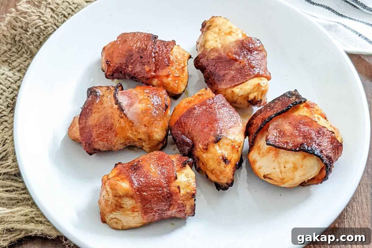 Holiday Air Fryer Recipes to Simplify Your Cooking 7 Bacon wrapped chicken served on a plate