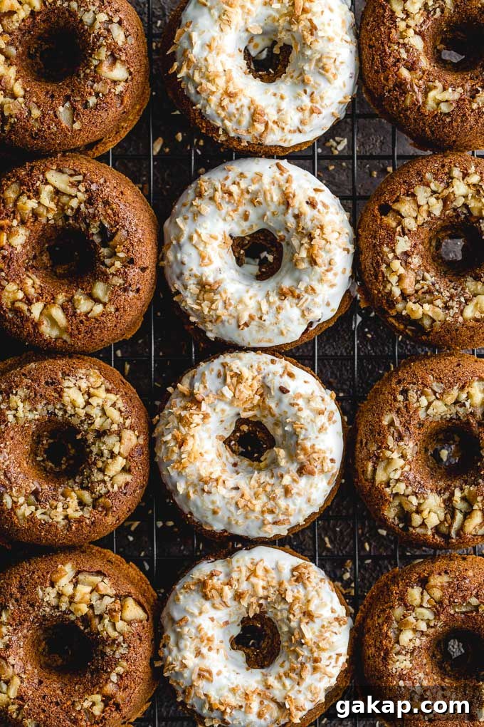 Gluten-Free Carrot Cake Donuts: Soft Spiced Donut Recipe 2 Overhead view of carrot cake donuts arranged on a cooling rack.