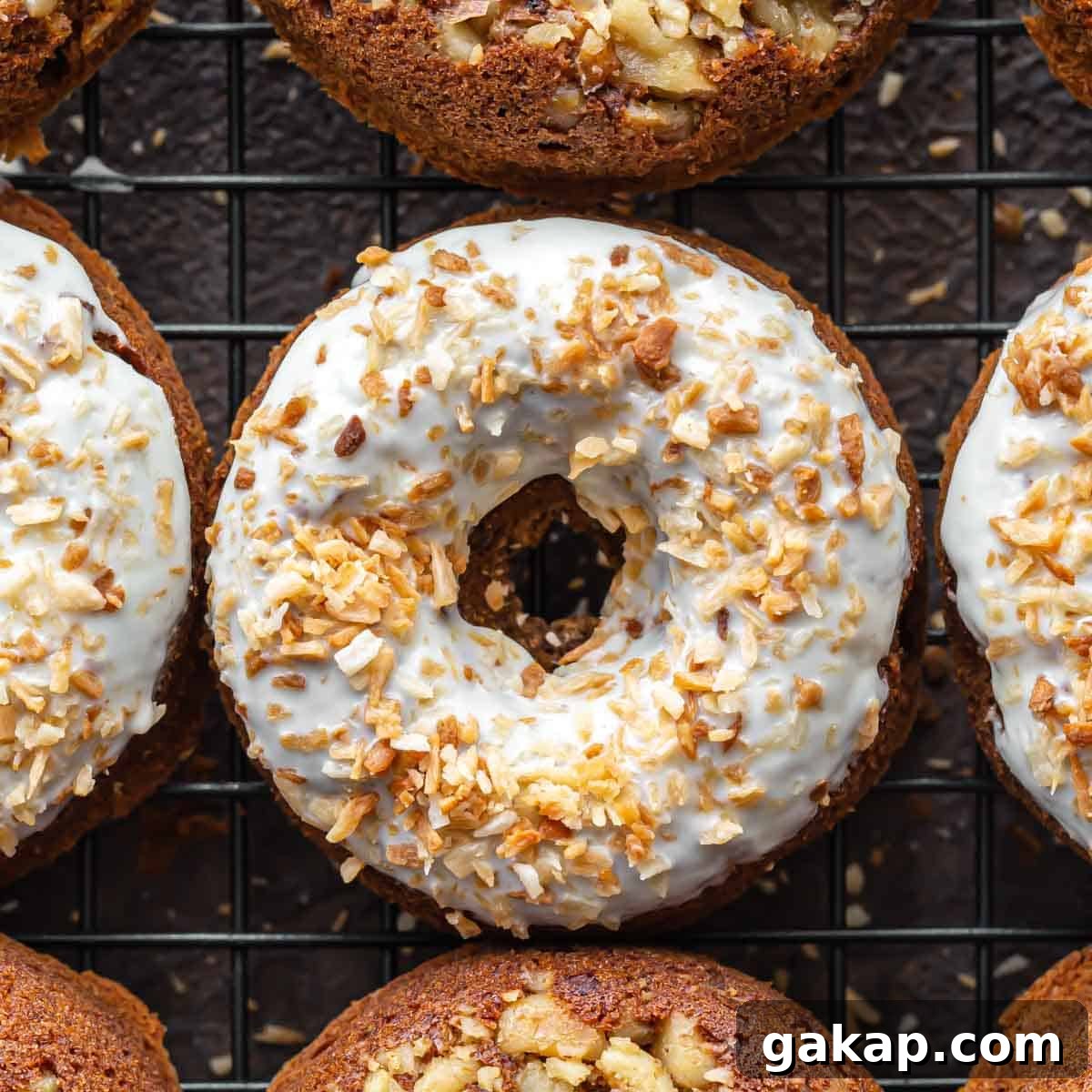 Gluten-Free Carrot Cake Donuts: Soft Spiced Donut Recipe 11 Overhead close up of carrot cake donuts on a wire cooling rack.