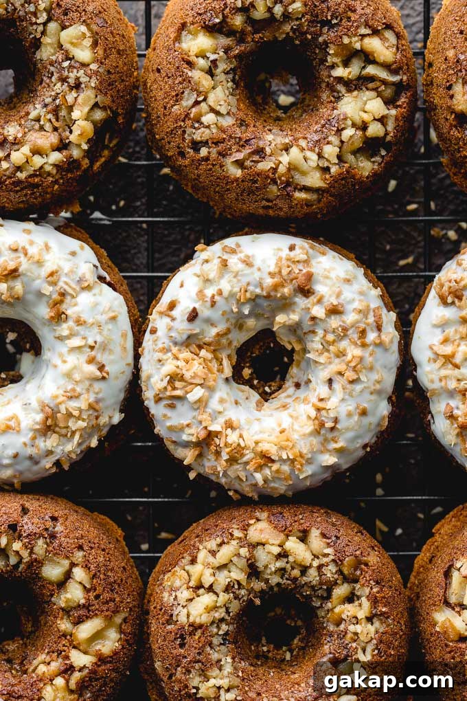 Gluten-Free Carrot Cake Donuts: Soft Spiced Donut Recipe 10 Up-close view of carrot cake donuts on a wire rack.