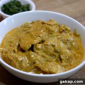 chicken pasanda served in a white color bowl.