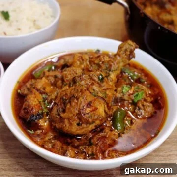 dum ka murgh served in a white bowl.