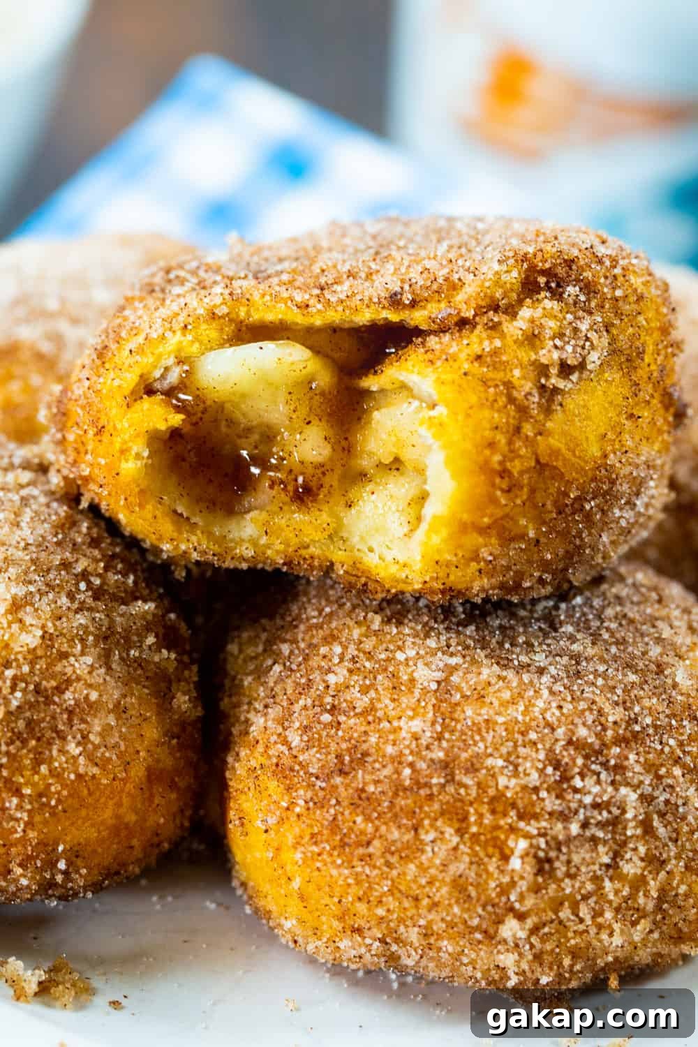 Air Fryer Apple Pie–Stuffed Biscuits: Quick Cinnamon Dessert 7 Close-up of Air Fryer Apple Pie Stuffed Biscuits with bite bitten out.