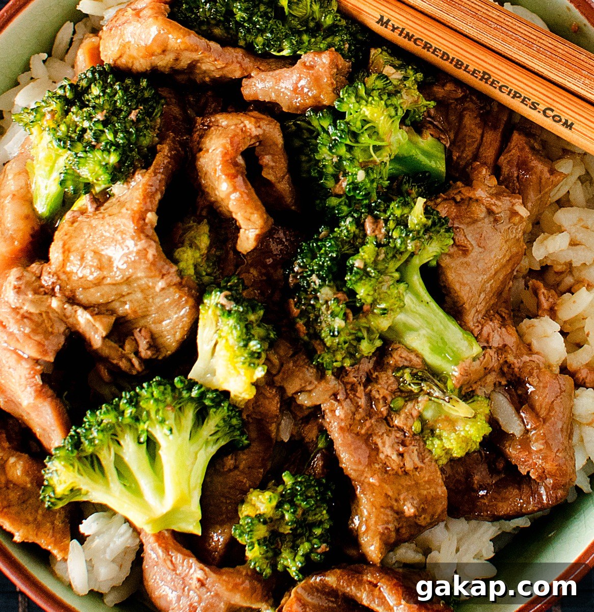 Slow Cooker Beef & Broccoli in a pretty chinese printed bowl close up
