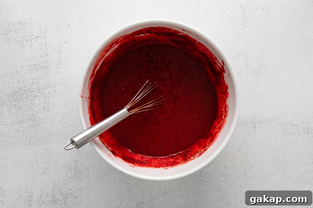 Decadent Red Velvet Cupcakes with Cream Cheese Frosting 7 red velvet cupcake batter in a bowl.
