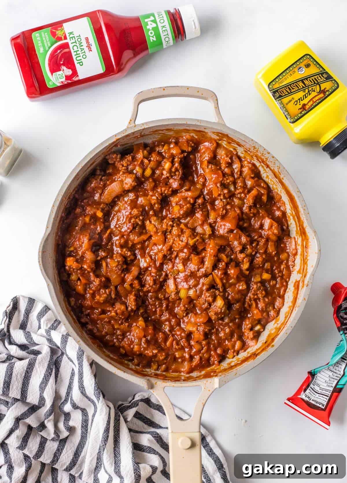 Thick, saucy homemade sloppy joe sauce with beef mixture in a skillet.