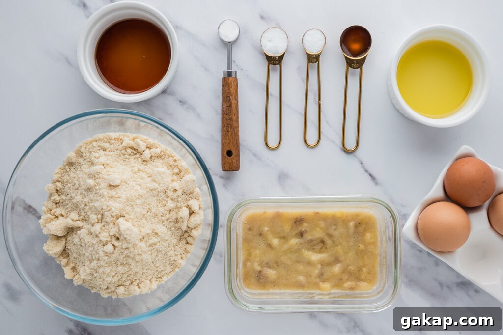 Almond flour banana bread ingredients arranged on a counter including ripe bananas, almond flour, eggs, and maple syrup.