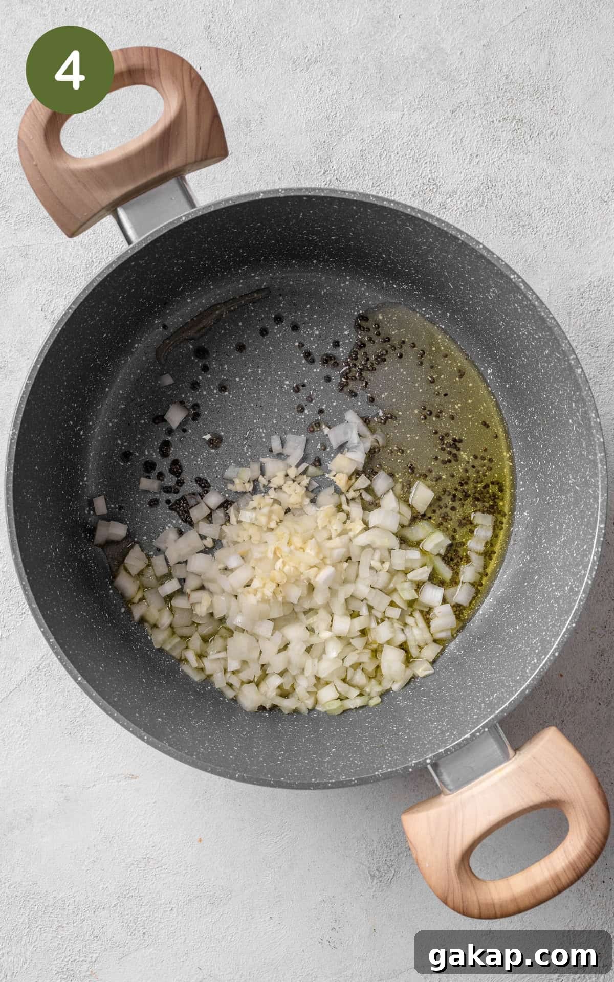 Garlic, onion and spices in a pan.