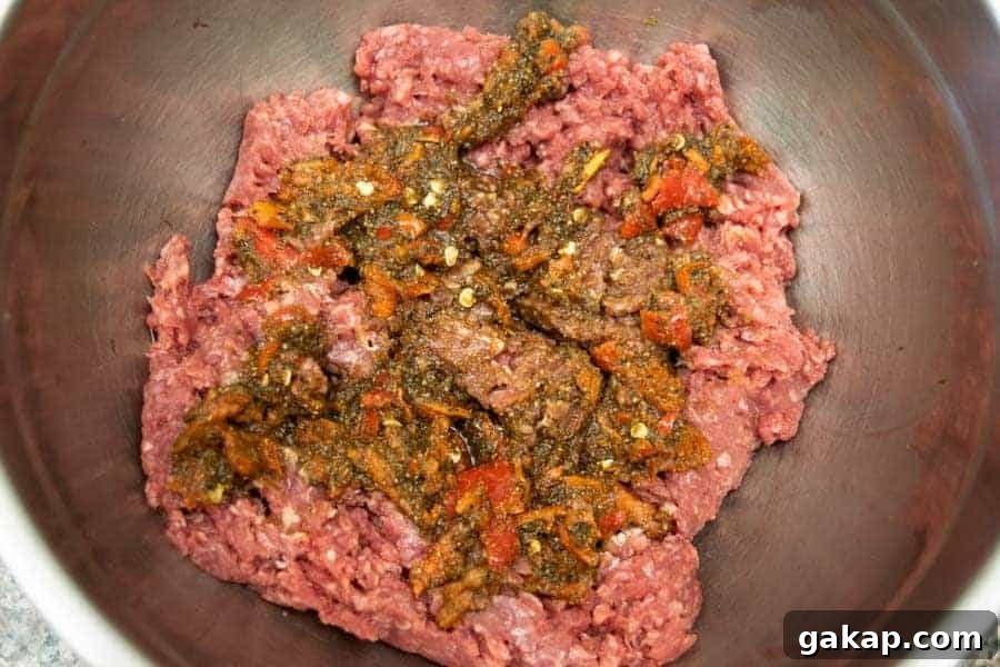 Spicy Fiery Ground Beef Jerky Recipe 6 spicy ingredients on top of ground beef for jerky
