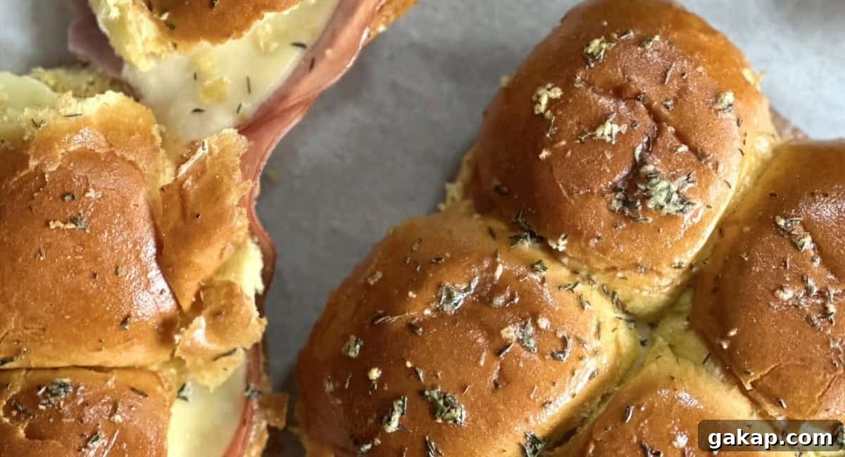 Overhead image of hot garlic butter ham and cheese sliders. 