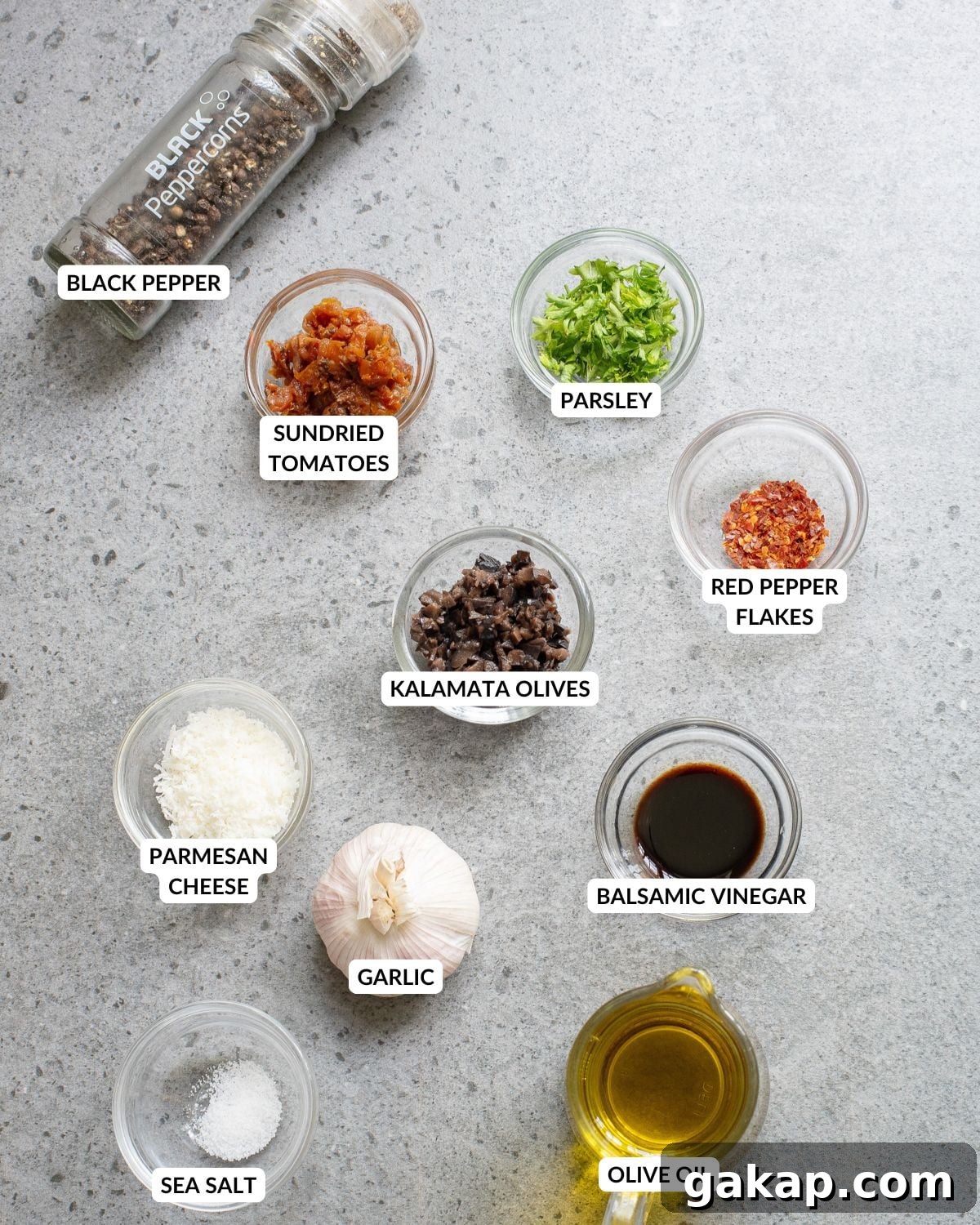 An overhead image of the ingredients of olive oil bread dip.