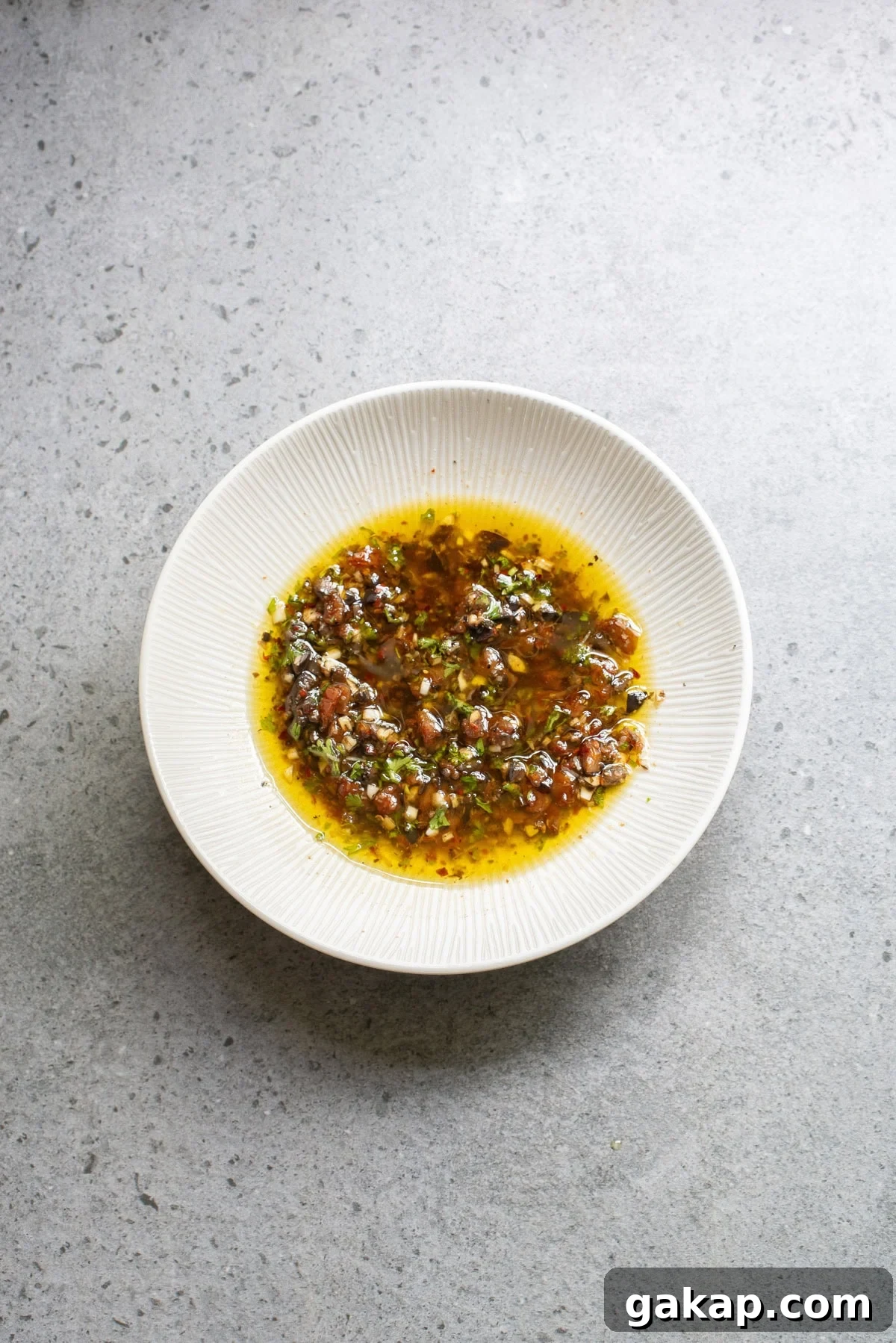 An overhead image of olive oil bread dip.