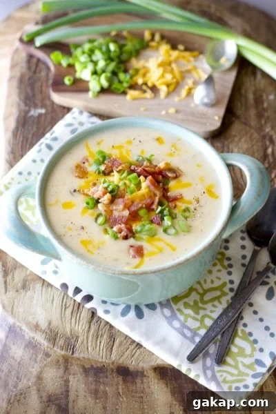 Easy Potato Soup! Top with bacon cheddar and green onions for the ultimate comfort food! 