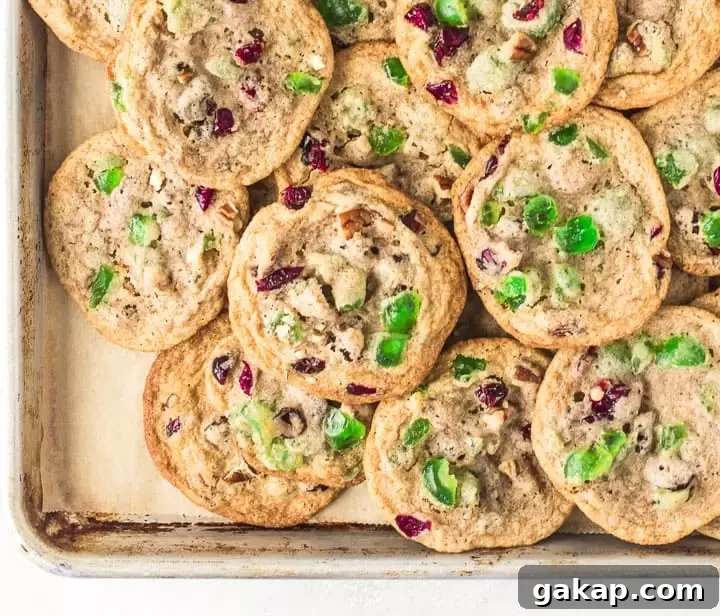 overhead photo of fruitcake cookies on a baking sheet