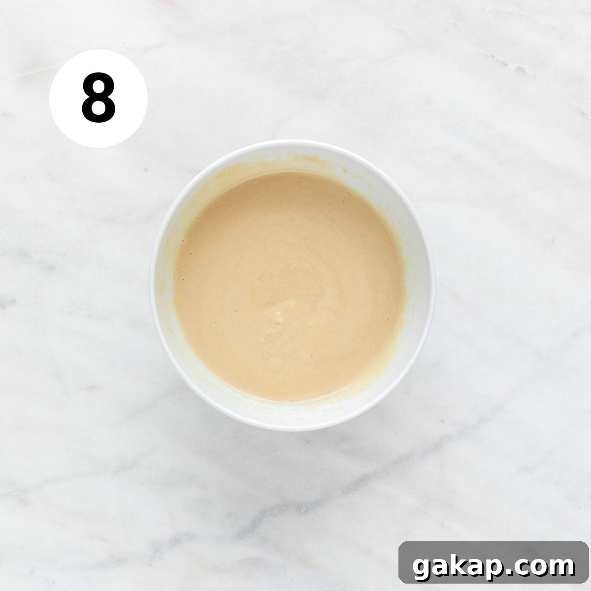 Lemon tahini dressing in a bowl.
