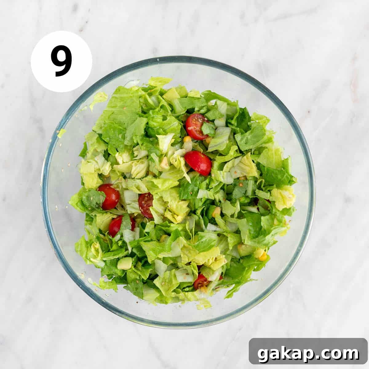 Salad veggies in a large bowl.