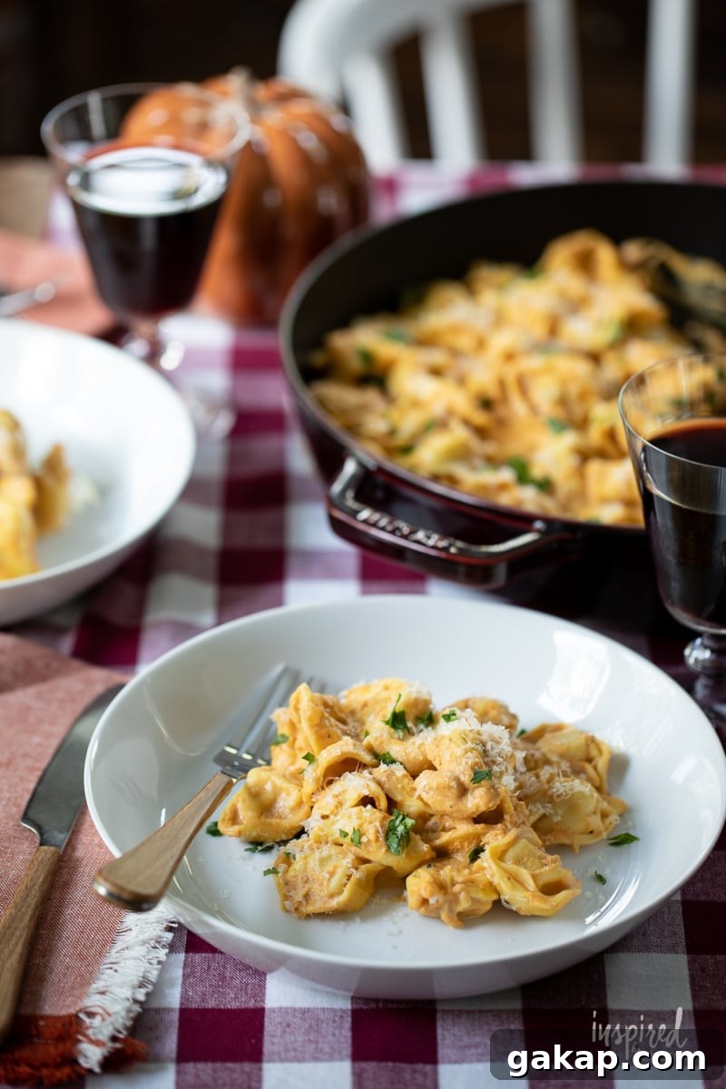 14 Memorable Friendsgiving Recipes Everyone Will Rave About 20 Creamy Pumpkin Tortellini serve on plates and in a pan.