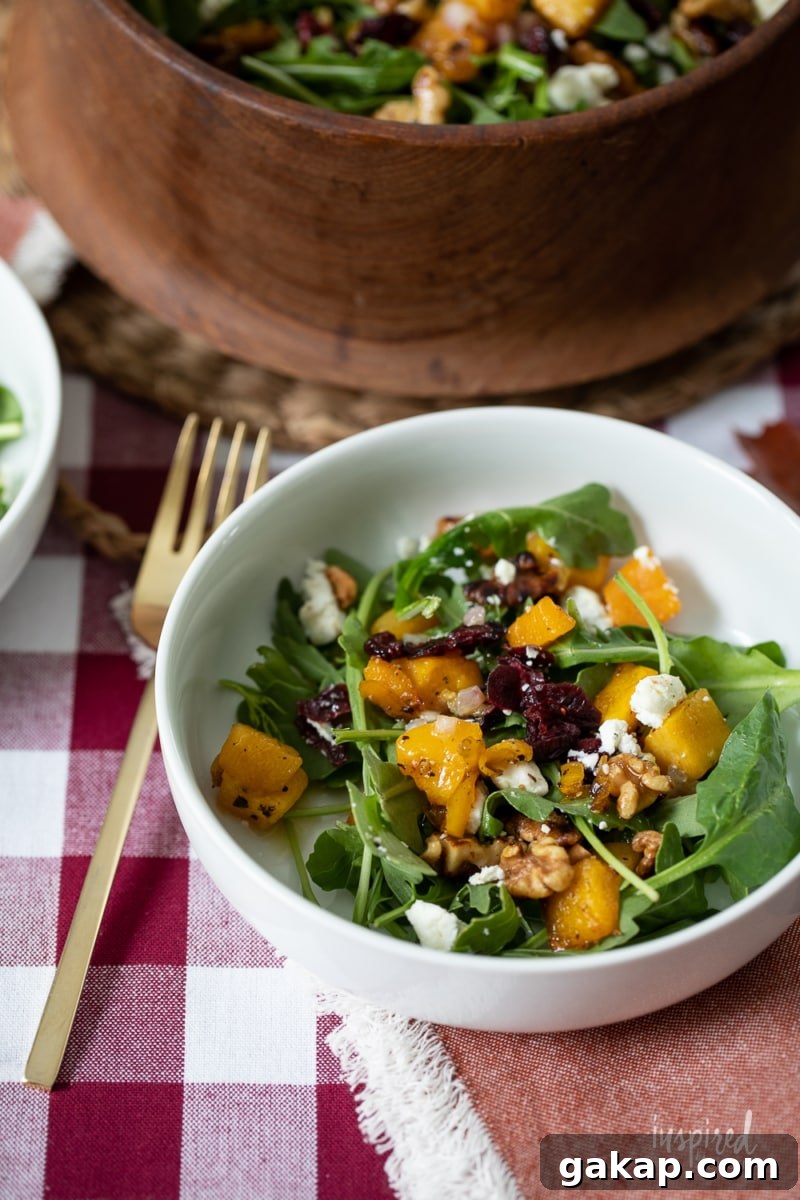 14 Memorable Friendsgiving Recipes Everyone Will Rave About 10 Butternut Squash Fall Salad Recipe in bowls.