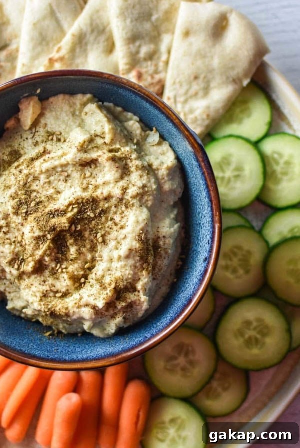 Creamy Caramelized Shallot Dip Recipe for Parties 7 Artichoke hummus with pita, cucumber, and carrots.