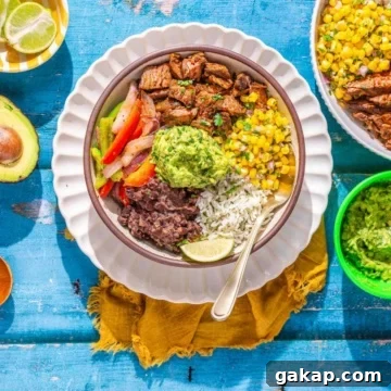 Steak and rice bowl on a flat surface.