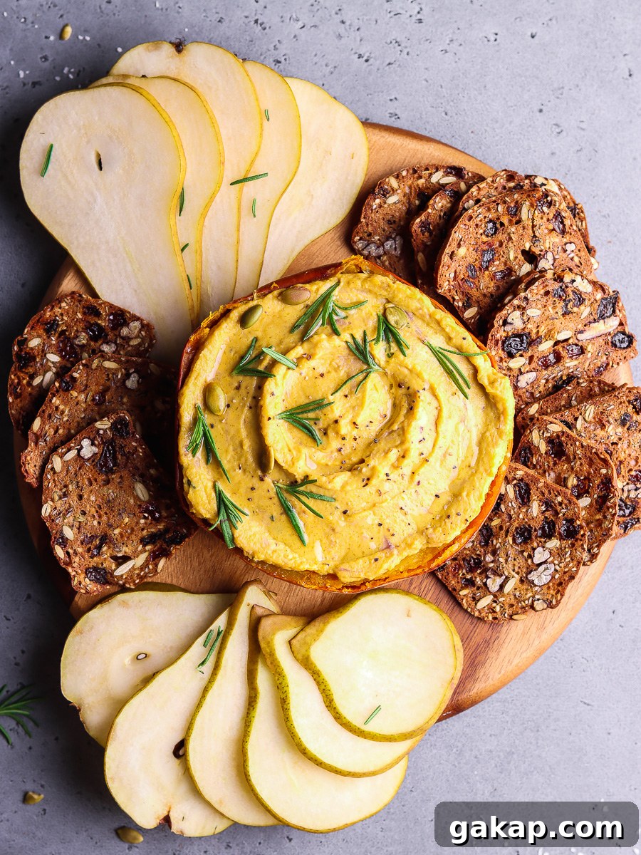 Creamy Pumpkin and Goat Cheese Dip for Fall Entertaining 7 pumpkin dip on a platter with crispy treats.