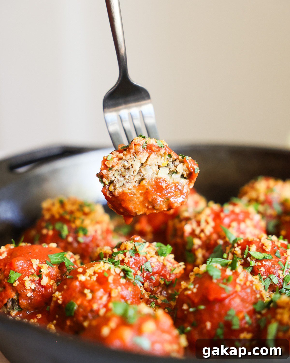 Vegan meatball on fork.