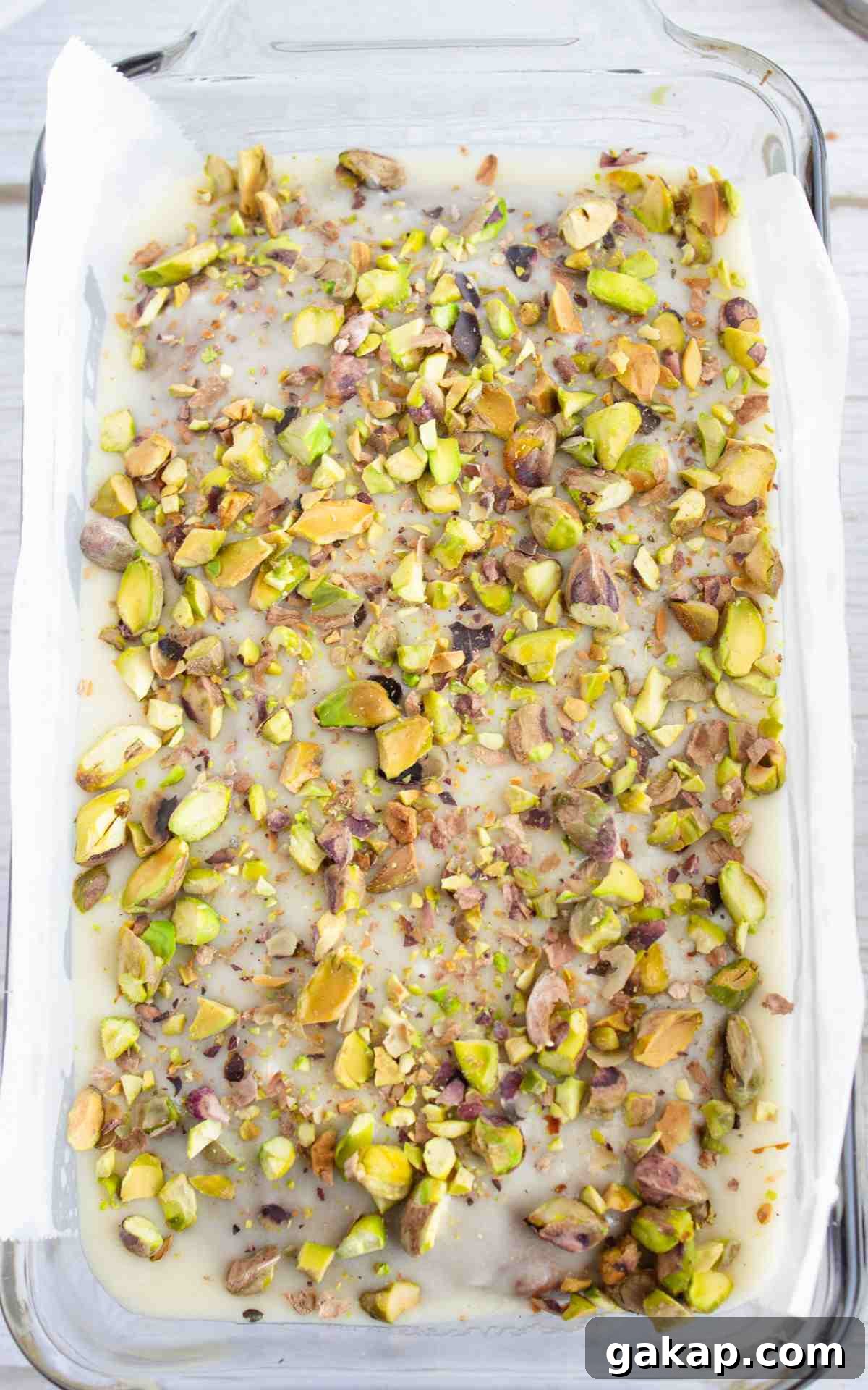 Pistachio Quick Bread Recipe: Moist Loaf with Crunchy Nuts 3 Crushed pistachios on almond icing for pistachio bread.
