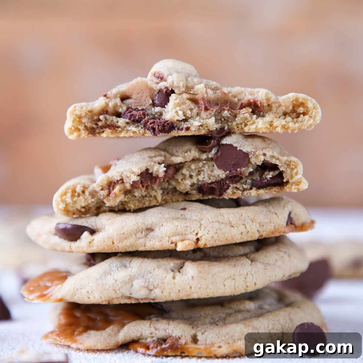 Brown Butter Snickers Caramel-Stuffed Chocolate Chip Cookies 3 Caramel Stuffed Brown Butter Snickers Chocolate Chip Cookies stacked interior detail