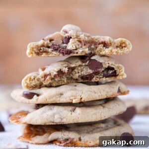 Brown Butter Snickers Caramel-Stuffed Chocolate Chip Cookies 6 Caramel Stuffed Brown Butter Snickers Chocolate Chip Cookies stacked interior detail.