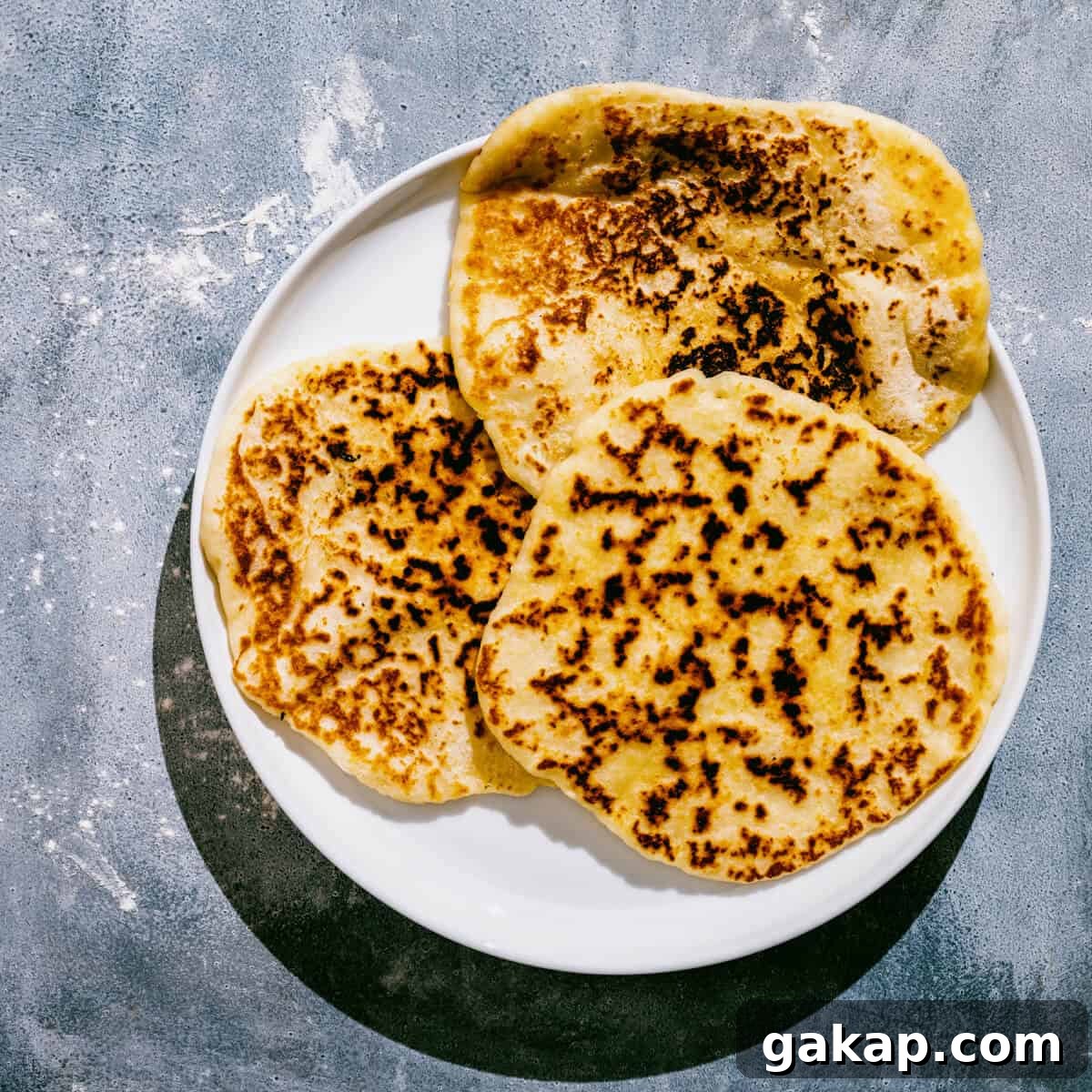 a whiter plate with 3 Greek yogurt flatbreads.