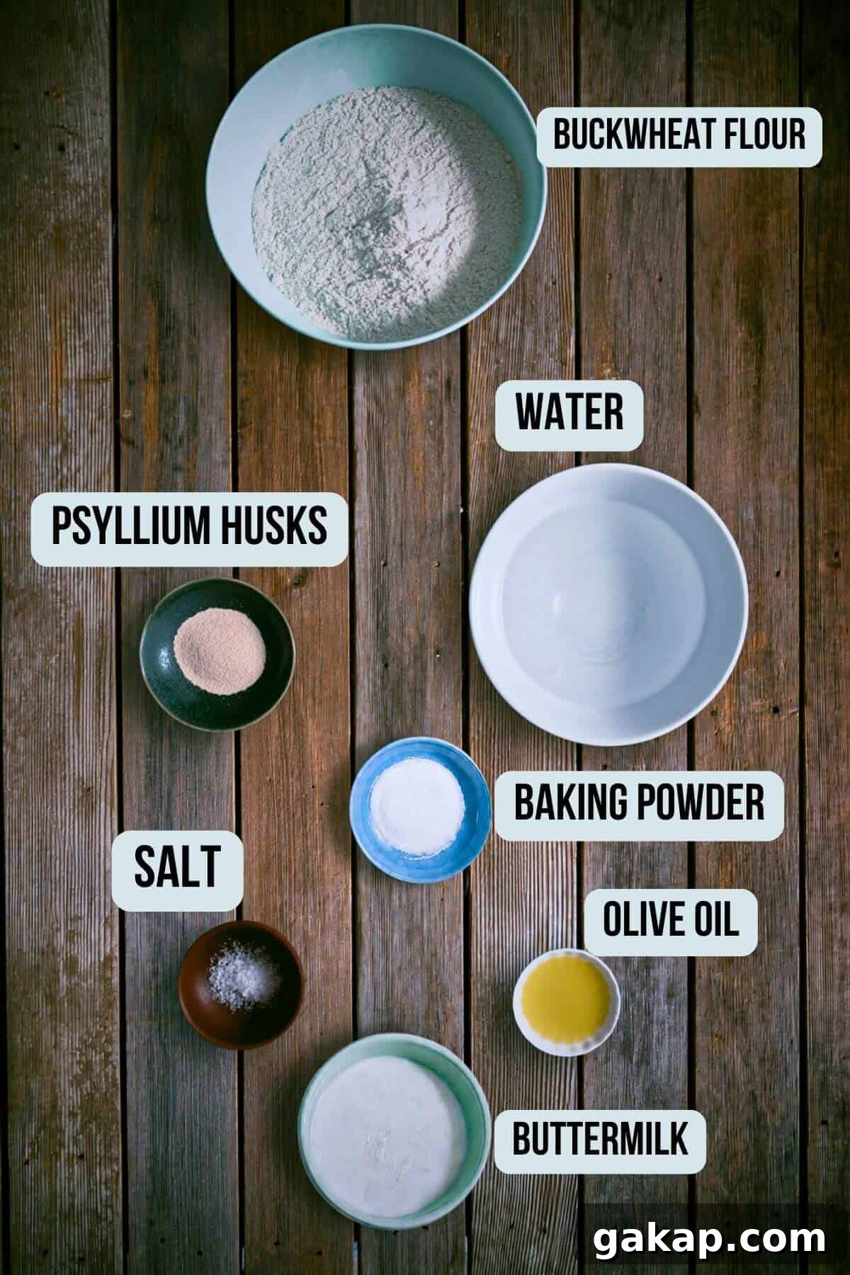 the ingredients required to make buckwheat pita bread presented on a rustic wooden surface.