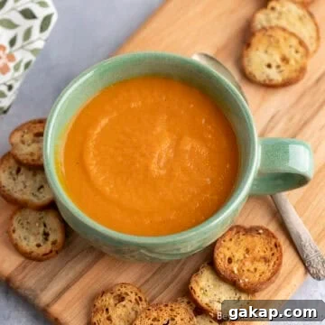 Carrot Ginger Soup in a green mug.
